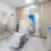Nordclinic gydymo kabinetas Kaune su reguliuojama kėde, mediniais baldais, veidrodžiais ir moderniu dizainu.