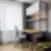 Šiuolaikiška darbo vieta su ergonomine kėde, lentynomis ir natūralios šviesos apšvietimu Balcia Residence apartamentuose.