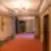 Grand Poet Hotel by Semarah viešbučio koridorius su liftų zona ir raštuotu kilimu.