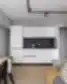 Moderni virtuvėlė su valgomojo zona ir poilsio kampeliu Balcia Residence apartamentuose.