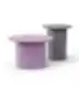 Two modern round coffee tables with cylindrical bases in purple and grey.