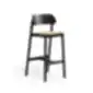 Black Paged Nimm bar stool with upholstered seat and wooden backrest, studio view