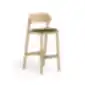 Light brown wooden Paged Nimm bar stool with upholstered seat and wooden backrest, studio view