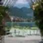 Pedrali Laja 5420 žalios spalvos lauko stalas su Intrigo kėdėmis ir Giravolta lempomis.
